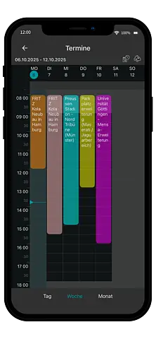 Smartphone zeigt die AppOne-Terminübersicht mit geplanten Baustellenterminen vor einem modernen Arbeitsplatz.